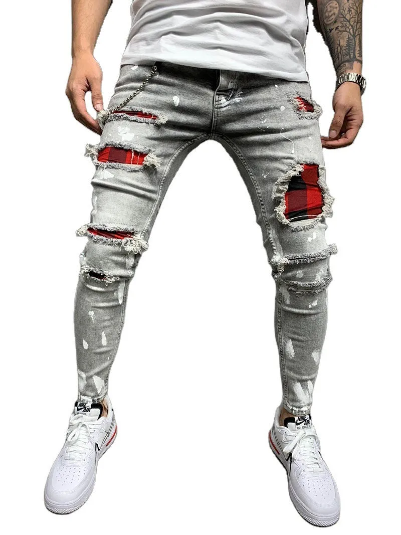 Men's ripped patch slim-fit jeans in gray with hand-painted details and zipper fly on white background