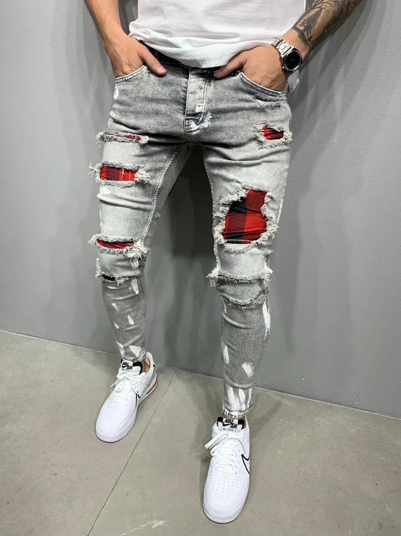 Men's ripped patch slim-fit jeans in gray with hand-painted details and zipper fly on white background