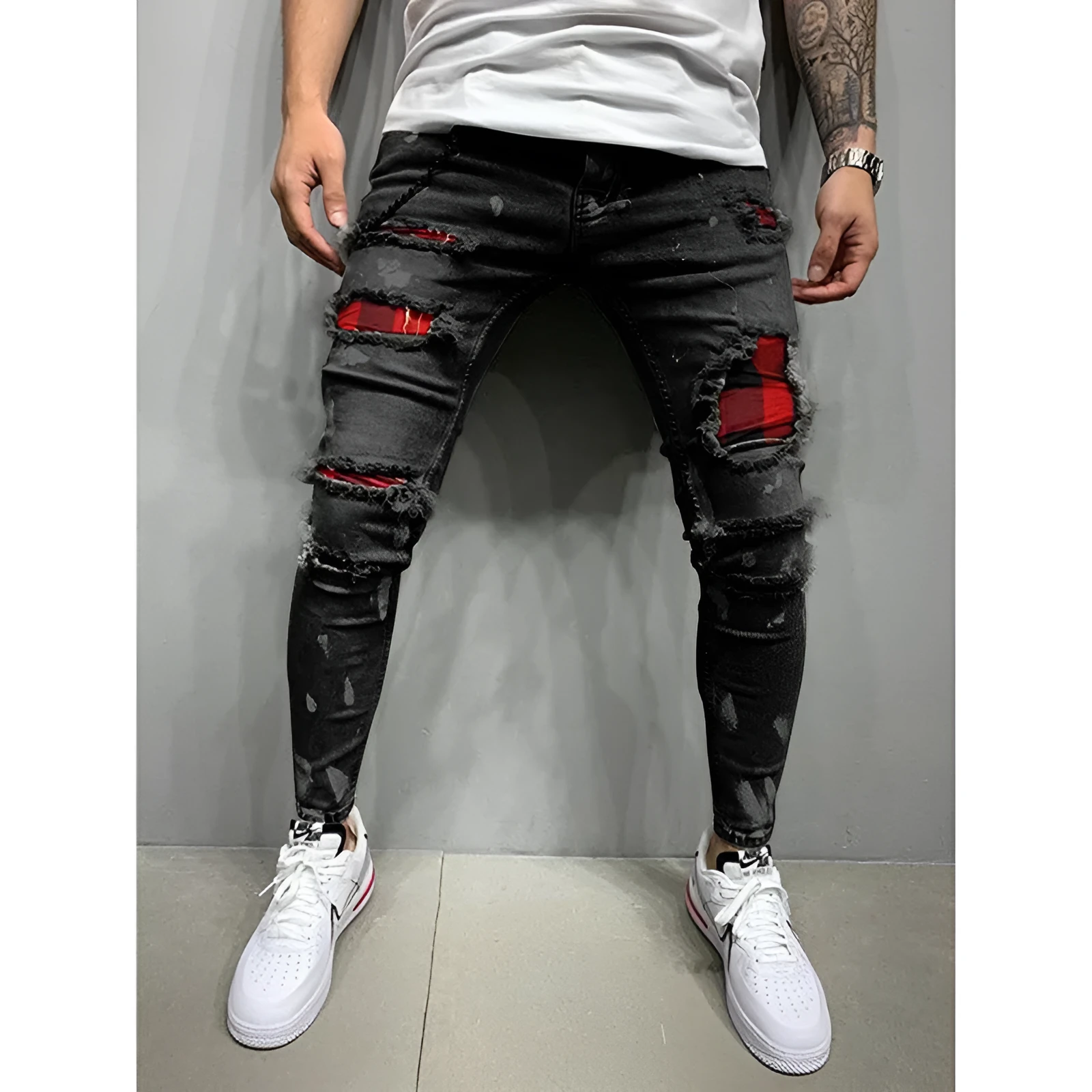 Men's ripped patch slim-fit jeans in gray with hand-painted details and zipper fly on white background
