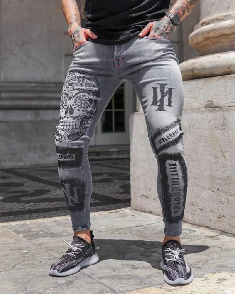 Men's ripped patch slim-fit jeans in gray with hand-painted details and zipper fly on white background