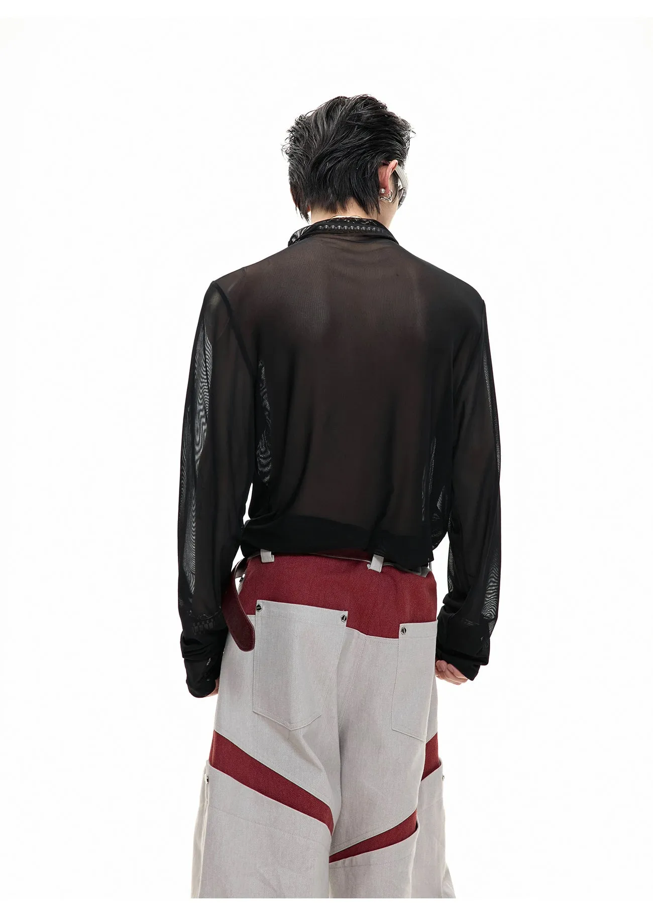 Black mesh slim-fit long sleeve bottoming shirt on a hanger, showing its lightweight texture and close cut.