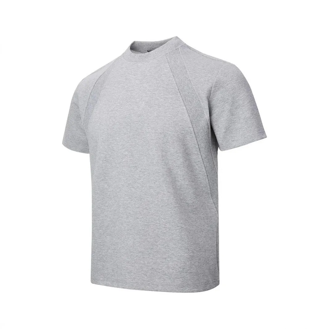 Men's loose fit short sleeve top in black with air layer stitching detail on a grey background.