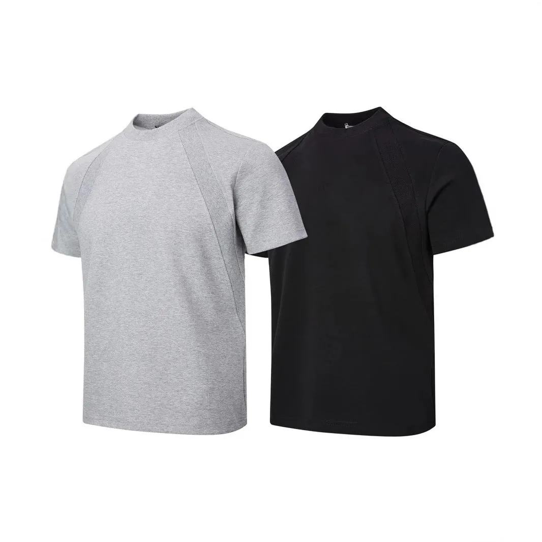Men's loose fit short sleeve top in black with air layer stitching detail on a grey background.