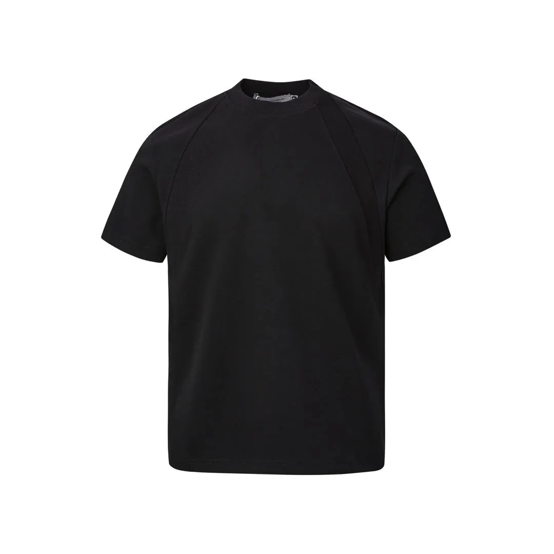 Men's loose fit short sleeve top in black with air layer stitching detail on a grey background.