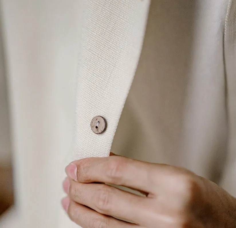 Light apricot men's shirt with bamboo pattern and Cuban collar shown on hanger