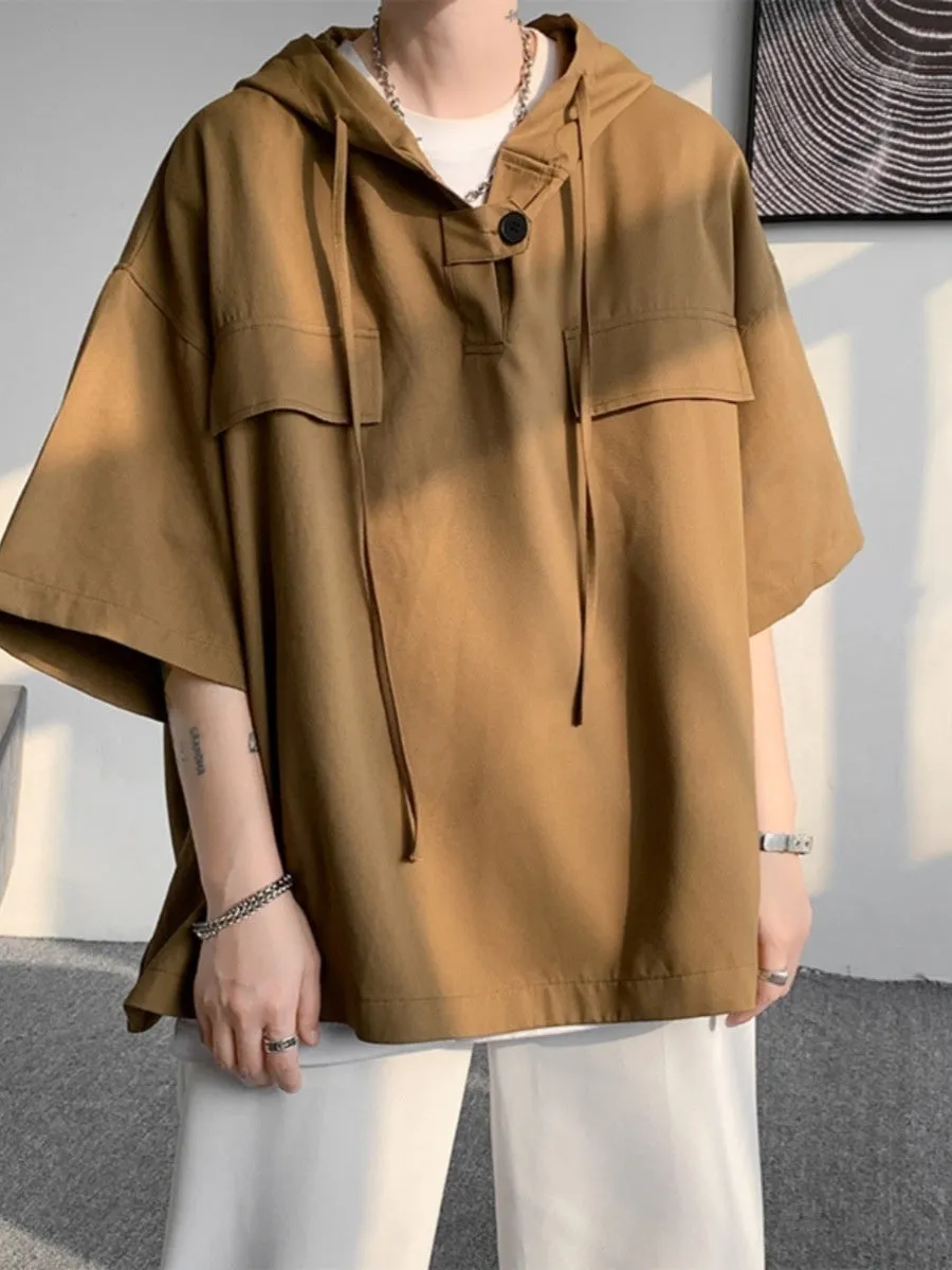 Man wearing a loose fit black hooded short sleeve T-shirt for summer.