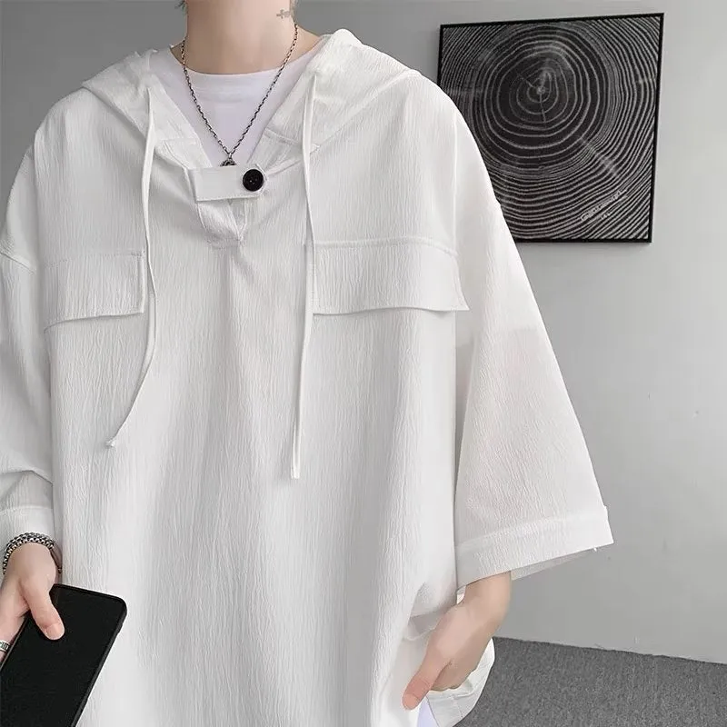 Man wearing a loose fit black hooded short sleeve T-shirt for summer.