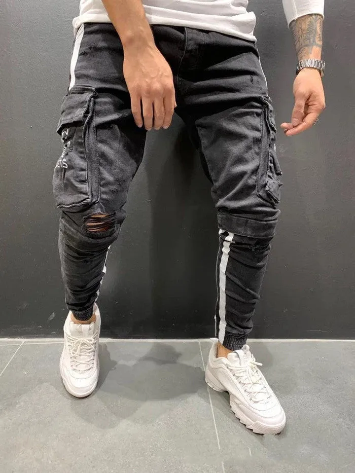 Men's denim knee-cut zipper trousers in black, 80% cotton, side view showing zipper placket and knee cut detail