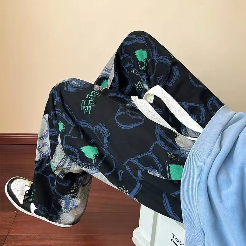 Men's casual polyester fibre trousers with cartoon print in black, size M to XXXL