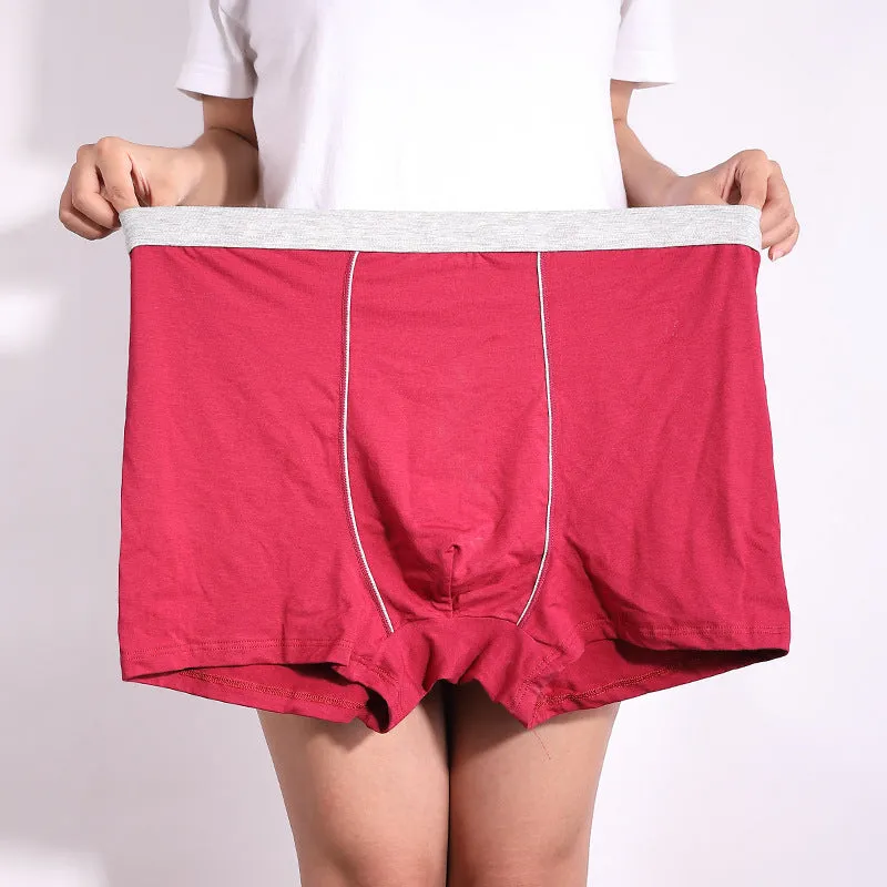 Men's oversized cotton baggy boxers in black, red, gray, blue and purple on a white background