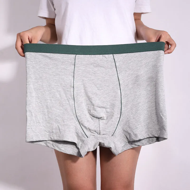 Men's oversized cotton baggy boxers in black, red, gray, blue and purple on a white background