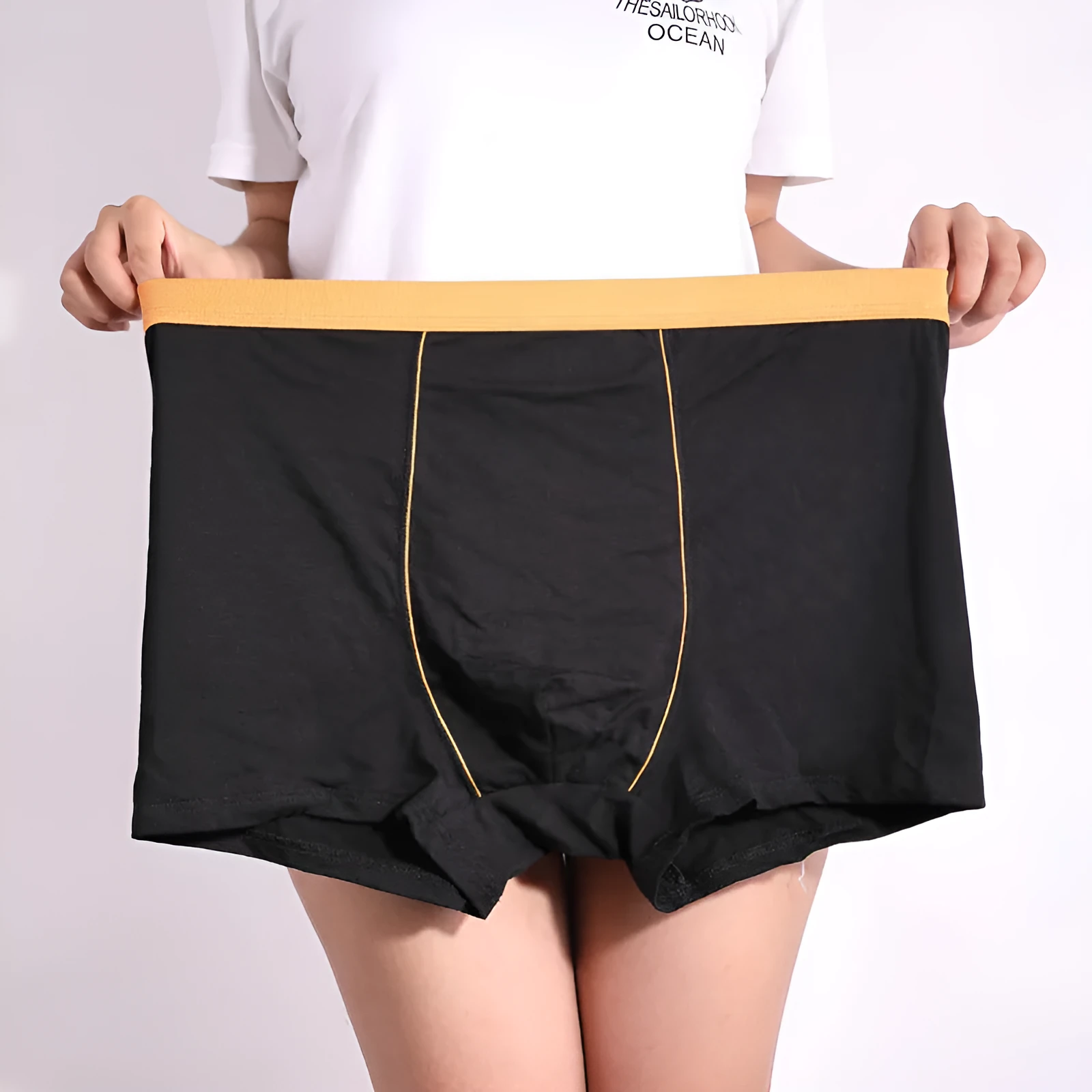 Men's oversized cotton baggy boxers in black, red, gray, blue and purple on a white background