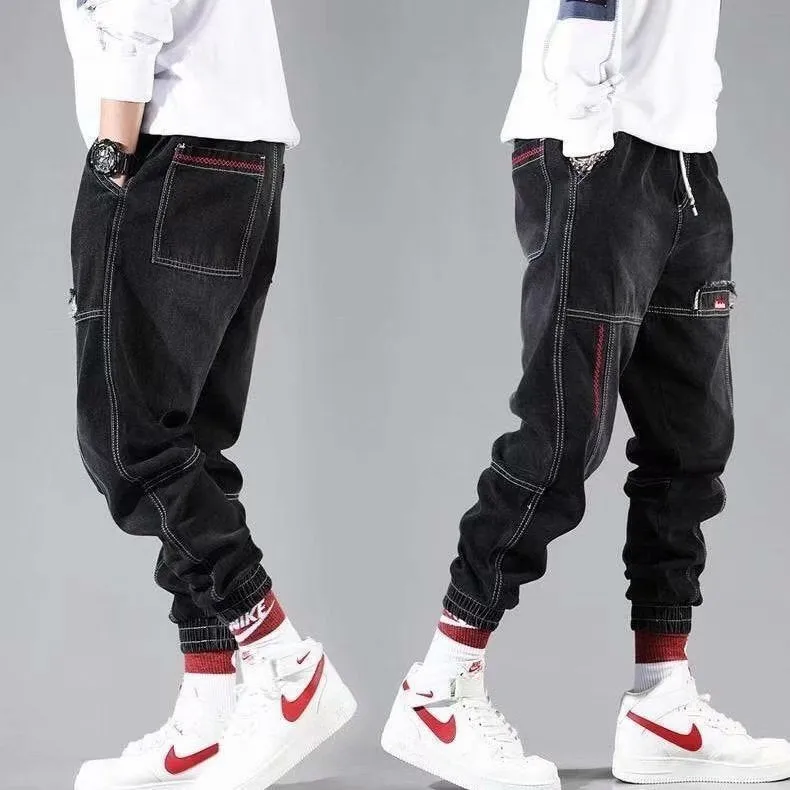 Plus size men's wide leg harem denim trousers with tie waist, available in black and light blue, sizes S to 5XL