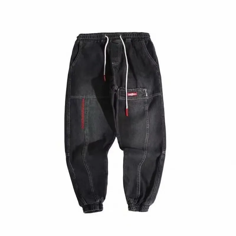 Plus size men's wide leg harem denim trousers with tie waist, available in black and light blue, sizes S to 5XL