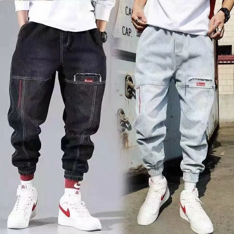 Plus size men's wide leg harem denim trousers with tie waist, available in black and light blue, sizes S to 5XL
