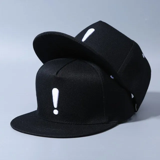 Cotton baseball cap with embroidered exclamation mark, adjustable dome crown, in black