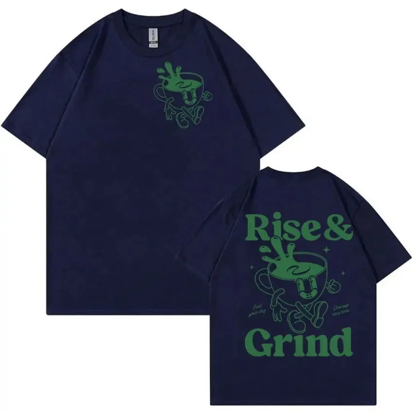Man wearing a loose black linen t-shirt with a green 'Rise And Grind Green Coffee' cartoon graphic print.