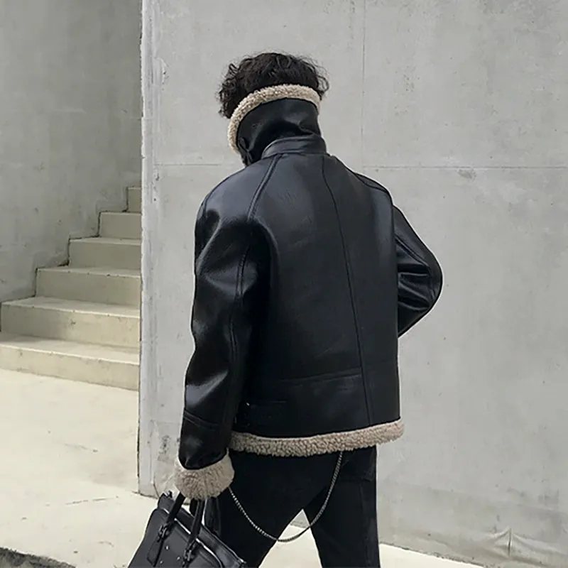 Men's black PU leather jacket with padded collar, front zip, and long sleeves on a model