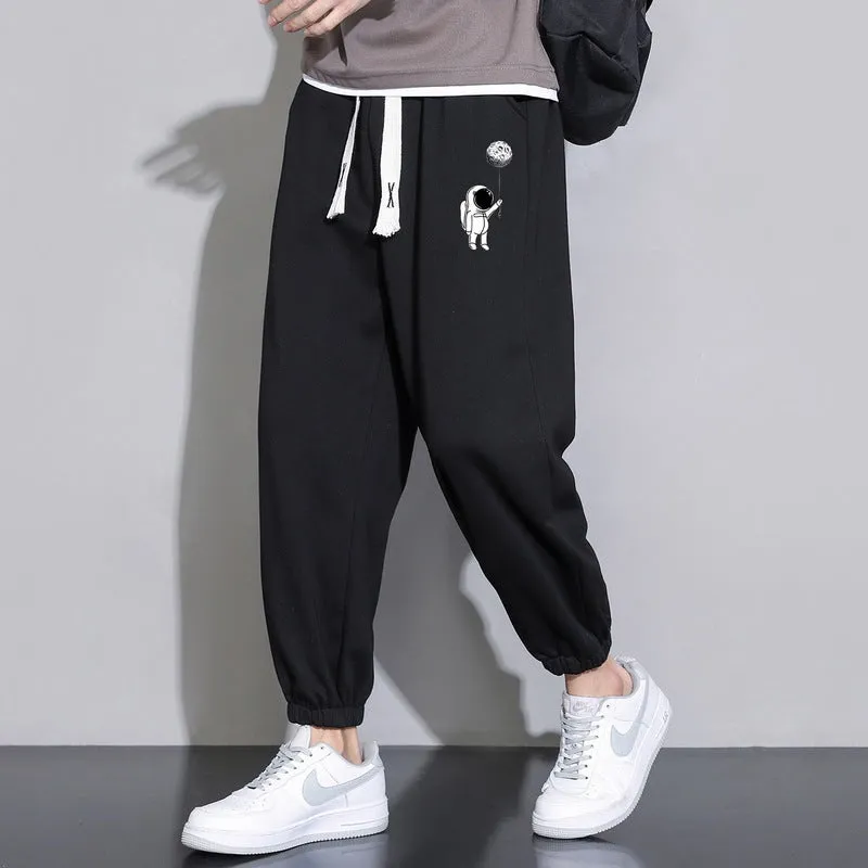 Men's cropped casual loose tapered pants in black, 100% polyester, mid waist, cropped length, sizes M to 4XL.