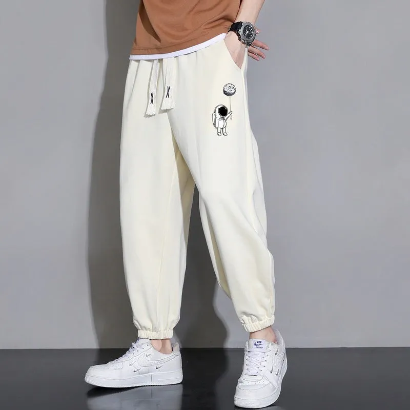 Men's cropped casual loose tapered pants in black, 100% polyester, mid waist, cropped length, sizes M to 4XL.
