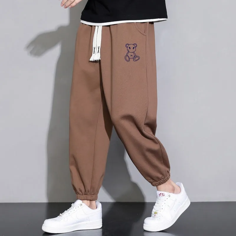 Men's cropped casual loose tapered pants in black, 100% polyester, mid waist, cropped length, sizes M to 4XL.