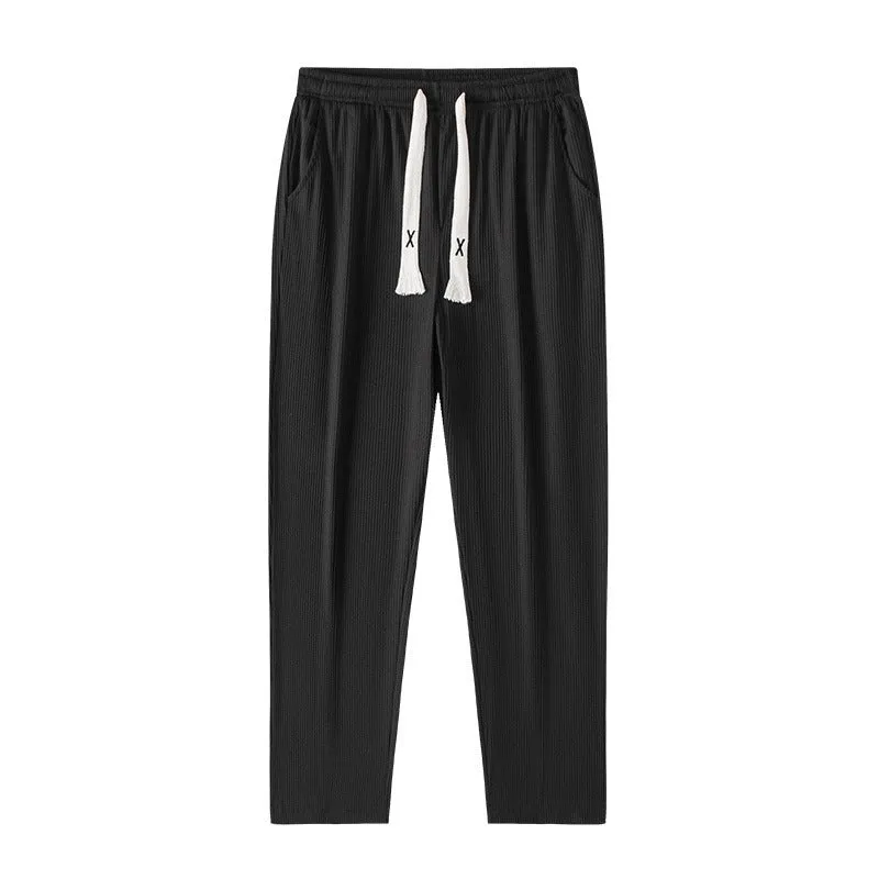Men's cropped casual loose tapered pants in black, 100% polyester, mid waist, cropped length, sizes M to 4XL.