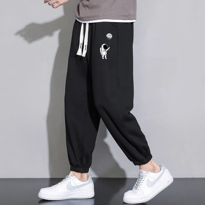 Men's cropped casual loose tapered pants in black, 100% polyester, mid waist, cropped length, sizes M to 4XL.