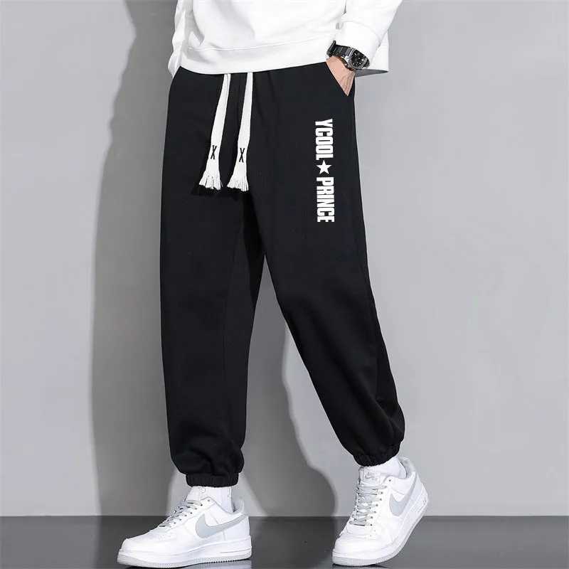 Men's cropped casual loose tapered pants in black, 100% polyester, mid waist, cropped length, sizes M to 4XL.