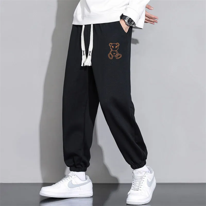 Men's cropped casual loose tapered pants in black, 100% polyester, mid waist, cropped length, sizes M to 4XL.