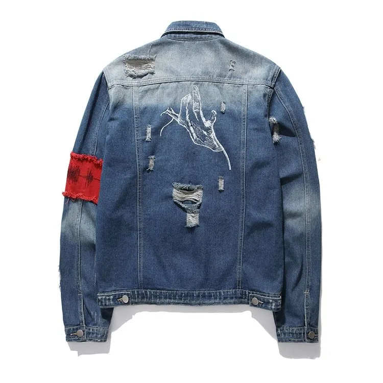 Blue embroidered cotton denim jacket for women on model, showing decorative stitching on front panels