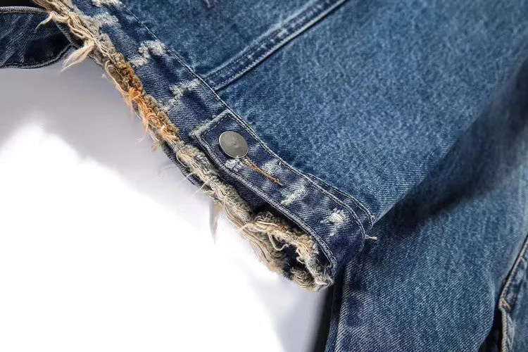 Blue embroidered cotton denim jacket for women on model, showing decorative stitching on front panels