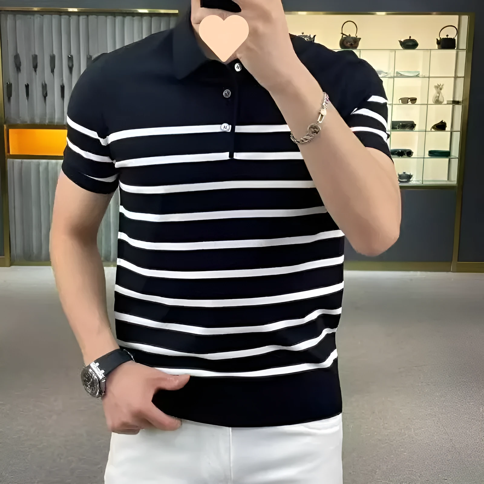 Black and white striped lapel pullover T-shirt laid flat, non-ironing polyester blend fabric.