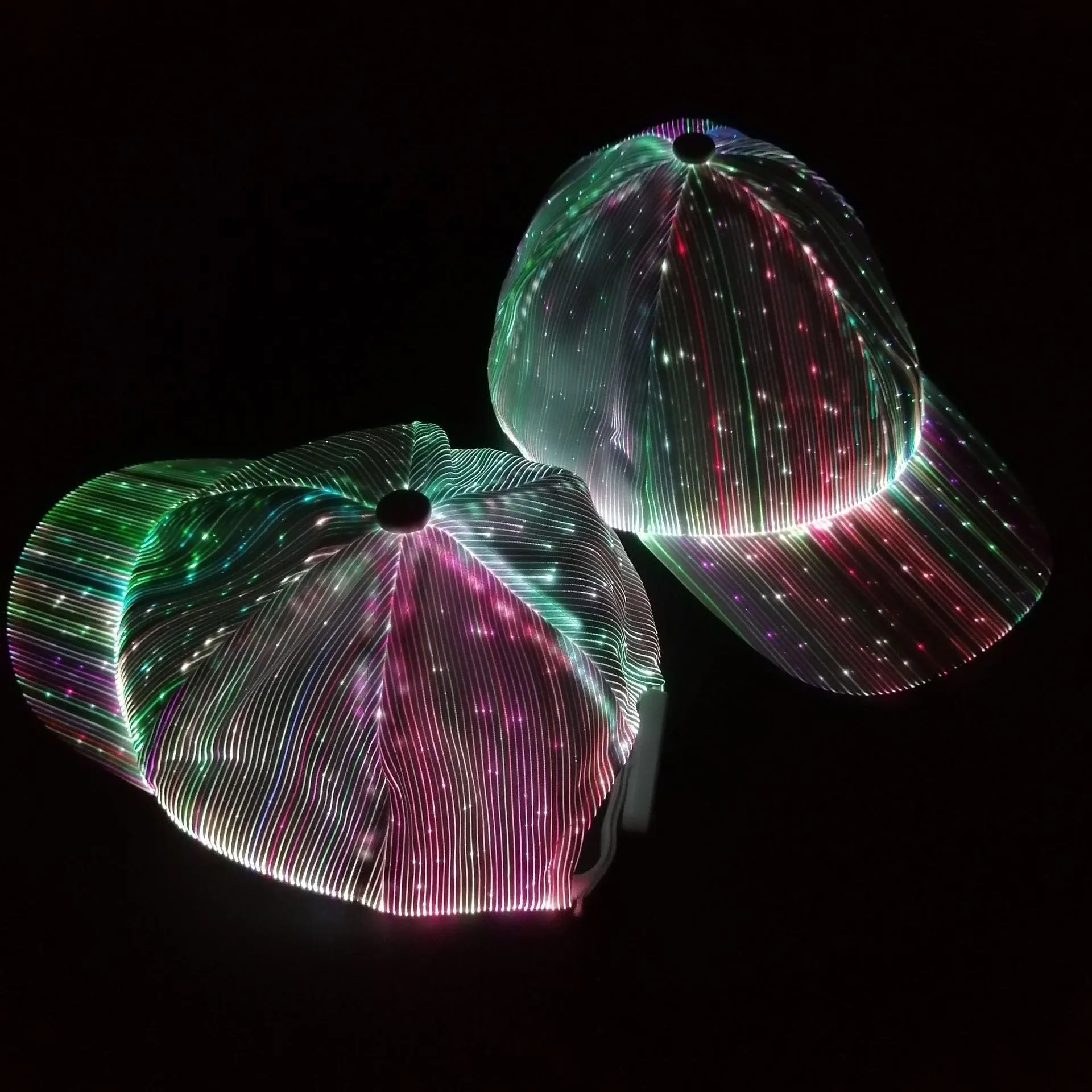 White unisex luminous baseball cap with fiber optic fabric LED glow against dark background