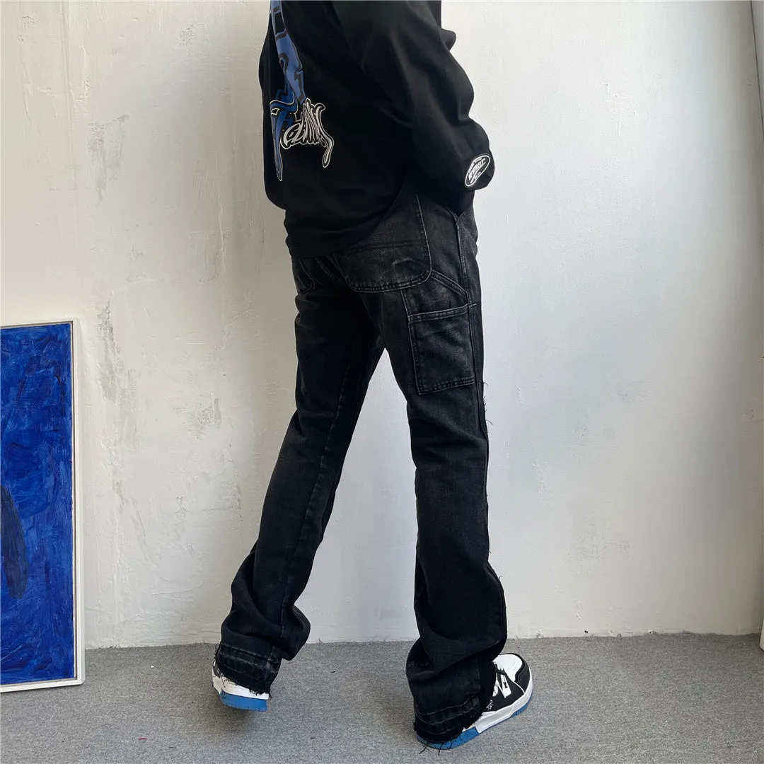 Women's micro flared patchwork raw edge jeans in black denim with loose straight tube fit, front view
