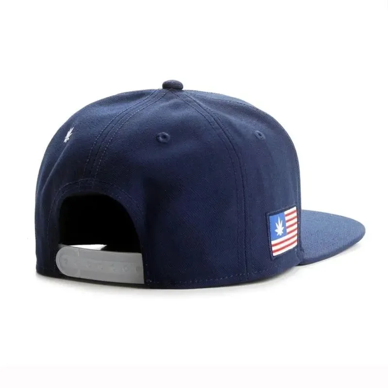 Navy blue cotton baseball cap with machine-embroidered English letters on front, dome crown, adjustable back strap