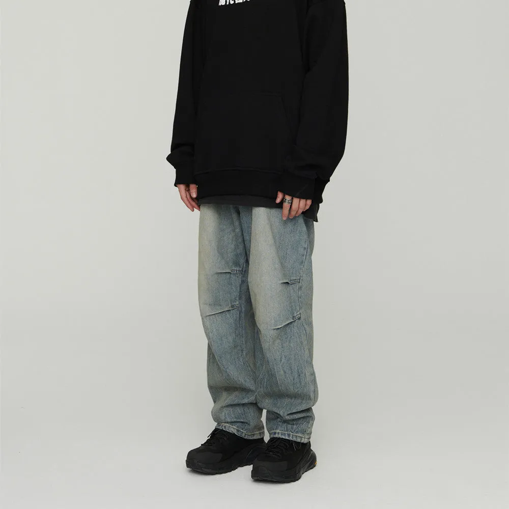 Light wash grey baggy oversized denim jeans with pleats, straight leg, 100% cotton, distressed washed blue