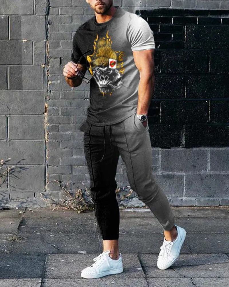 Men's grey polyester blend sport suit set with short sleeve T-shirt and matching trousers on a hanger.