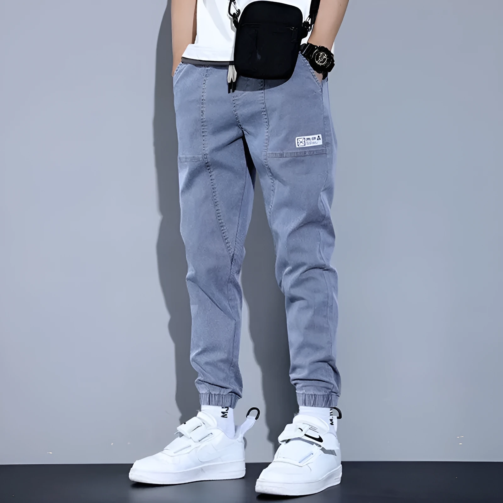 Two pairs of women's casual cotton jeans with mid waist and washed finish in grey and black