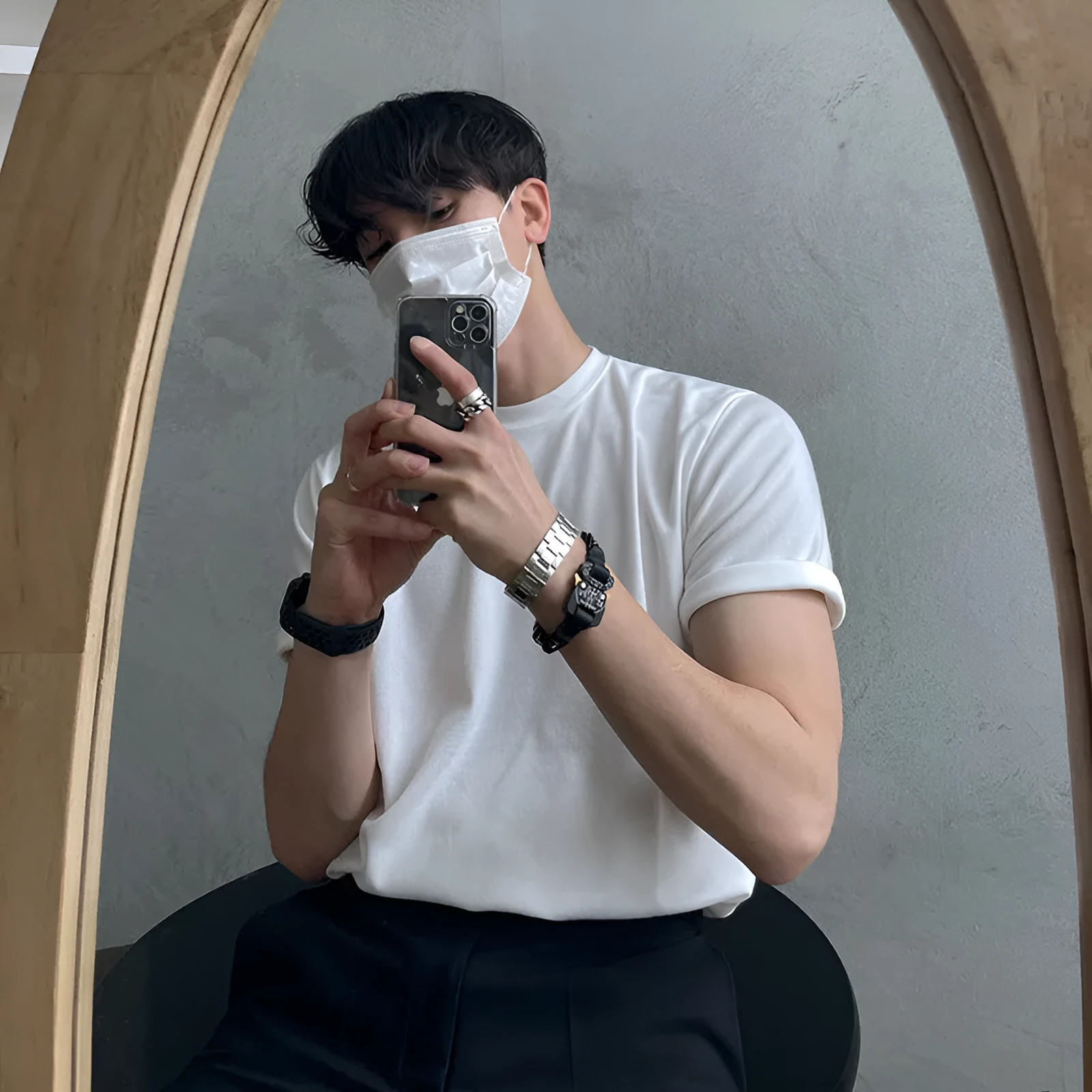 Men's slim fit plain cotton t-shirt in white on a hanger, showing round neck and half sleeve design.