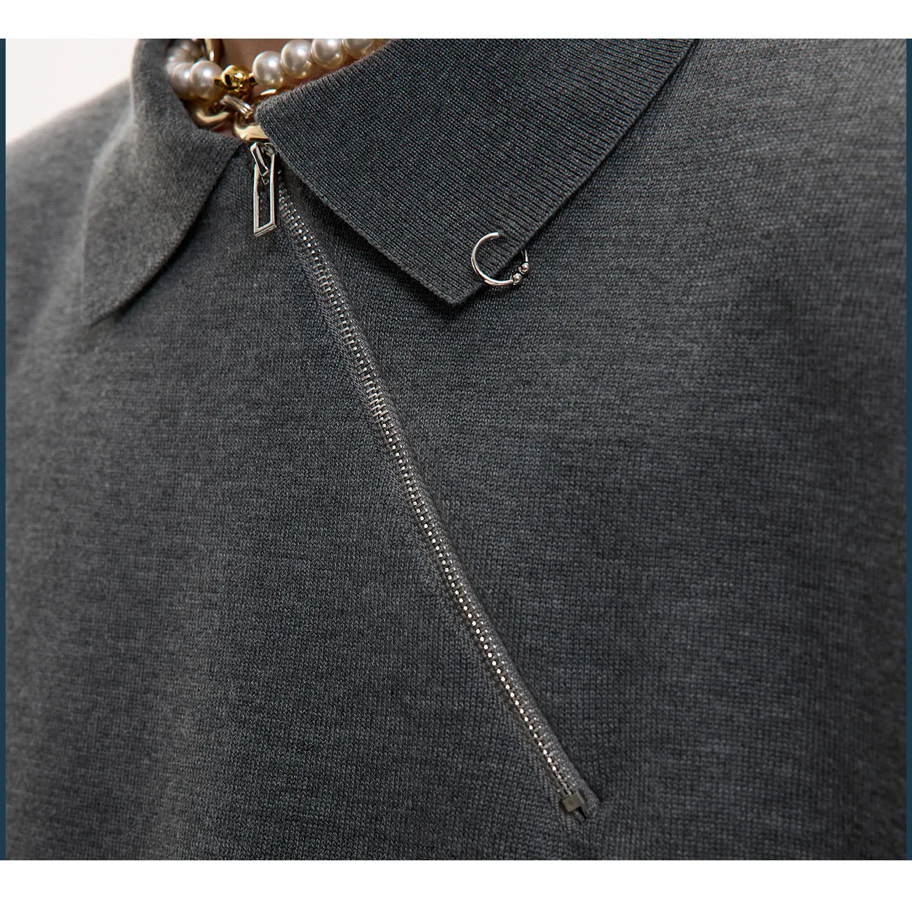 Men's black slim-fit knitted polo shirt with an oblique diagonal zipper on the lapel collar.