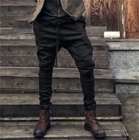 Men's black jogger sweatpants with loose fit and tapered leg design