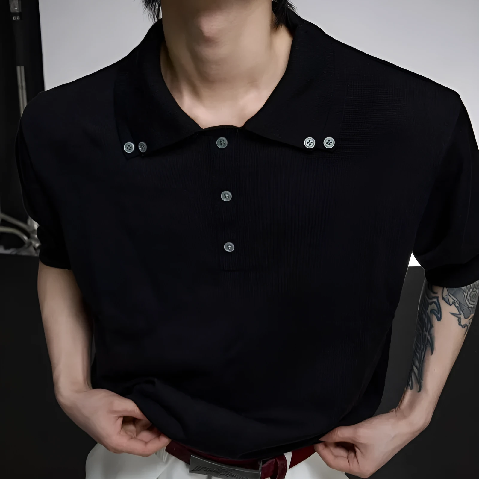 Men's black slim knit short sleeve shirt with double collar design and fastener decoration