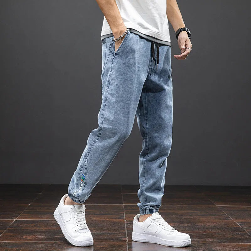 Men's cropped oversized slimming straight leg jeans in black, grey, and blue with high elasticity cotton blend