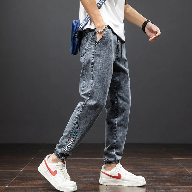 Men's cropped oversized slimming straight leg jeans in black, grey, and blue with high elasticity cotton blend