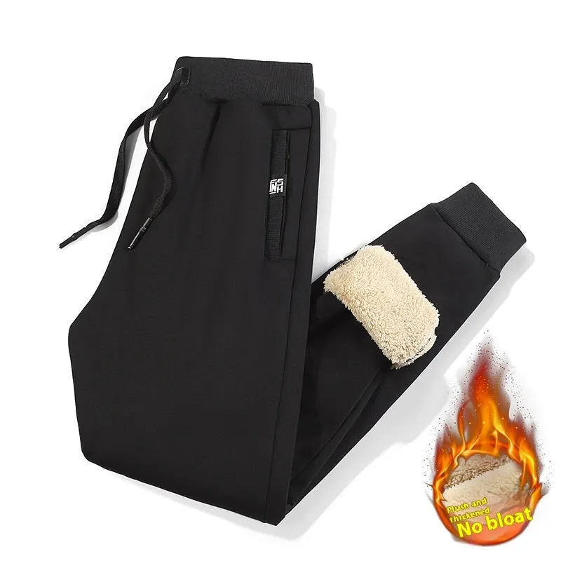 Men's grey fleece-lined cotton track pants with oversized fit and micro elastic waist.