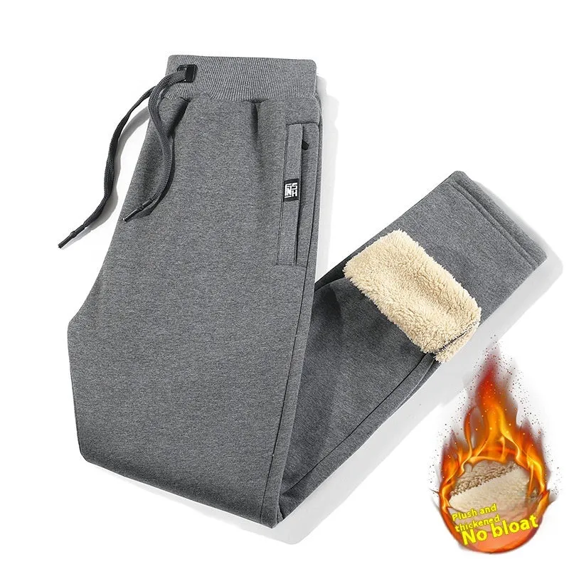 Men's grey fleece-lined cotton track pants with oversized fit and micro elastic waist.