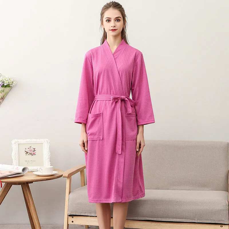 Women's and men's polyester nightgown cardigan with three-quarter sleeves in HFG navy blue, shown on a model for sleepwear use