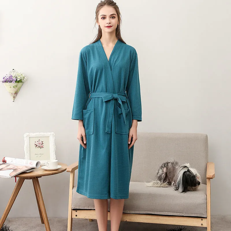 Women's and men's polyester nightgown cardigan with three-quarter sleeves in HFG navy blue, shown on a model for sleepwear use
