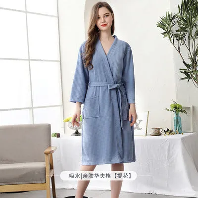 Women's and men's polyester nightgown cardigan with three-quarter sleeves in HFG navy blue, shown on a model for sleepwear use