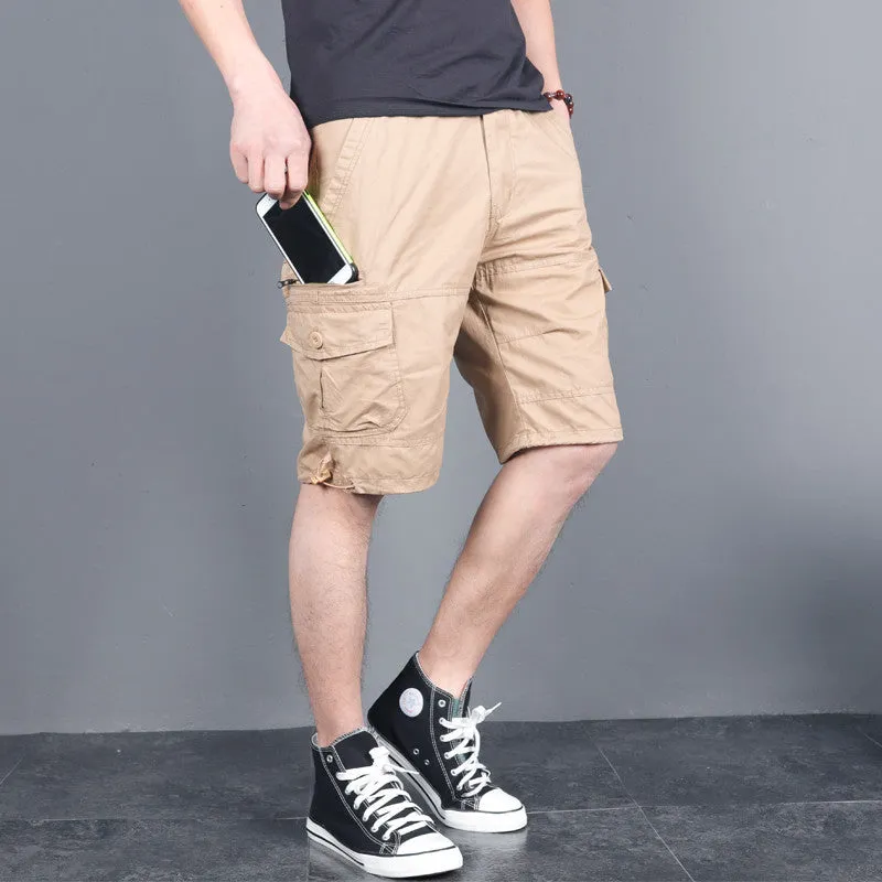 Green multi-pocket cotton cargo shorts with visible zippered side pocket, flat lay on white background